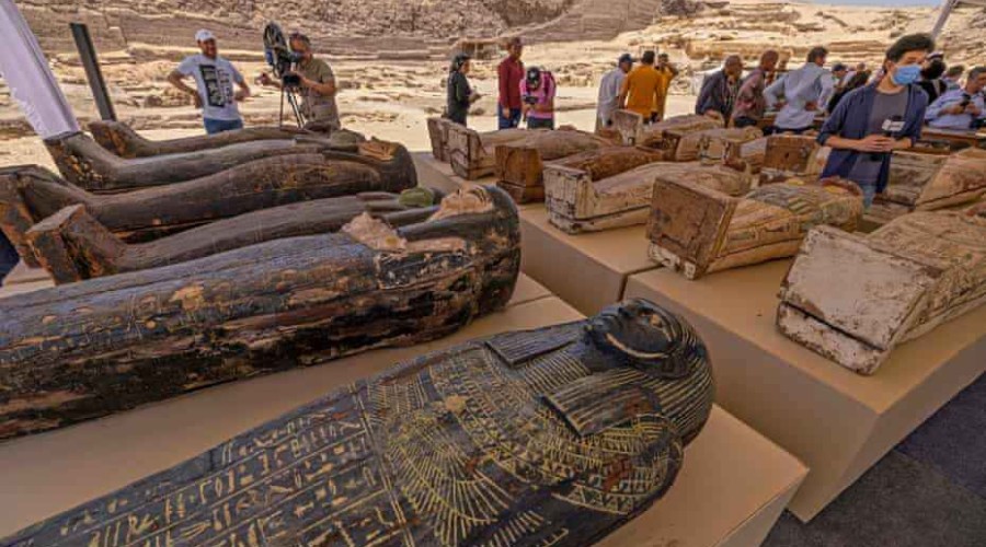 Trove of ancient Egyptian coffins and statues found at cemetery near Cairo