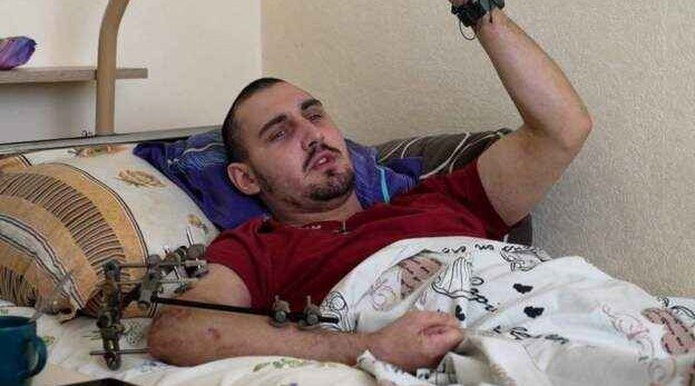 A wounded Ukraine solider but eager to go back to fight