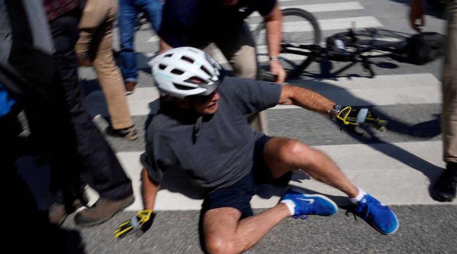 Biden falls after flubbing bike dismount, but uninjured