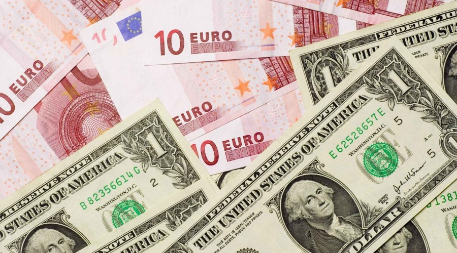 Dollar marches higher, euro teeters on brink of parity