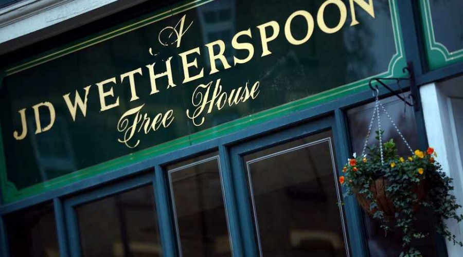 J D Wetherspoon flags annual loss as costs rise