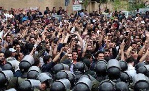 Iran police fire tear gas at protest over death in custody