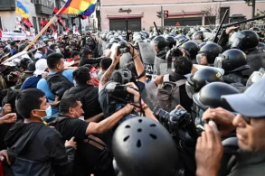 Peru protests: Police and anti-government protesters clash