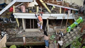 Indonesian rescue workers race to find victims of deadly quake