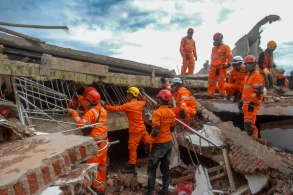 Six-year-old boy pulled alive from rubble of Indonesia quake