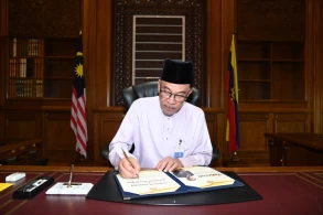 Malaysia’s Anwar starts work promising inclusive government