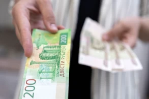 Rouble tumbles to near eight-month low vs dollar