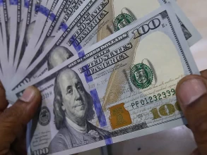 Dollar wavers after Fed minutes offer few surprises