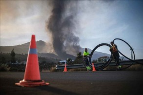 La Palma volcano leaves path of destruction as lava flows toward sea