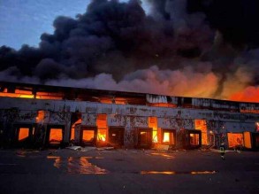 Firefighers extinguishing blaze at Kyiv warehouse