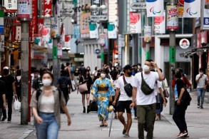 Japan set to remove all COVID restrictions as new infections ebb