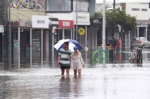 Thousands of Australians flee homes as floods inundate towns