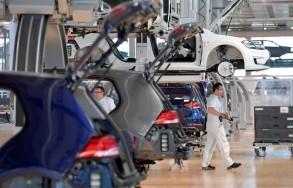 Gas-guzzling German carmakers face uphill struggle to go green