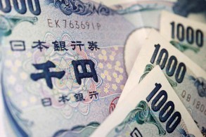 BOJ maintains ultra-low rates, warns it is closely watching yen moves