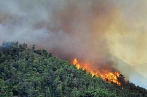 Wildfires burn, farmers struggle as another heatwave bakes