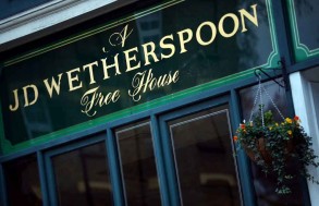 J D Wetherspoon flags annual loss as costs rise
