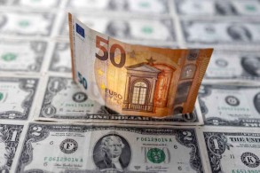 Dollar jumps, euro breaks parity after consumer prices surge